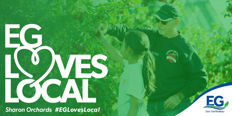 EG Loves Local
Sharon Orchards
#EGLovesLocal
Th photo is of an older man and a young child in the orchard.