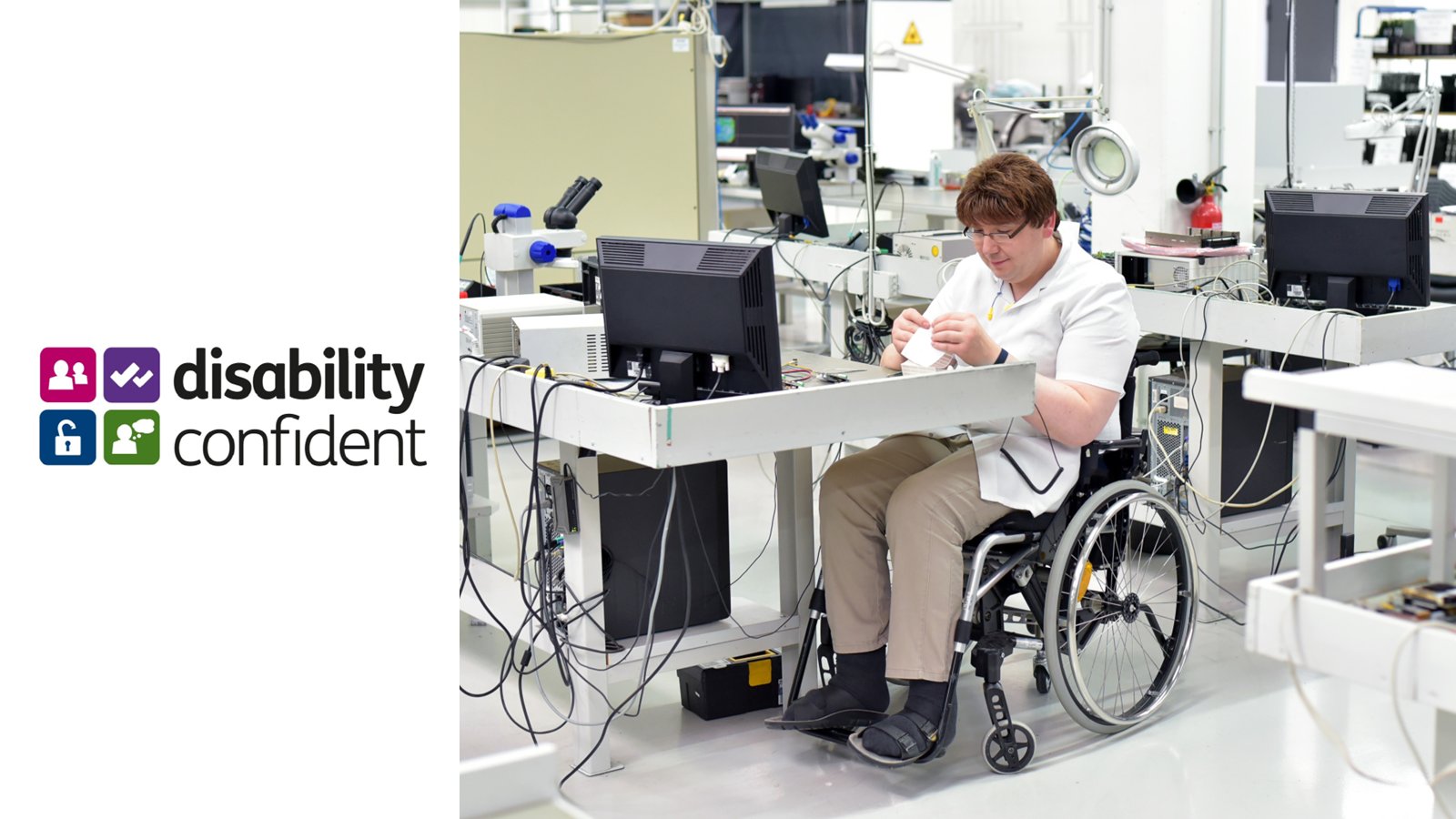 Image of a person in an electronics factory

Disability Confident Logo is on the left