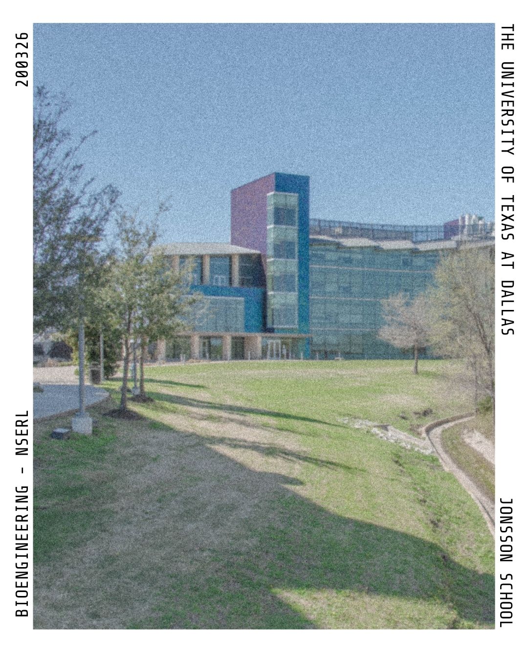 Grainy polaroid photo of an open grass feild with the NSERL building in the background