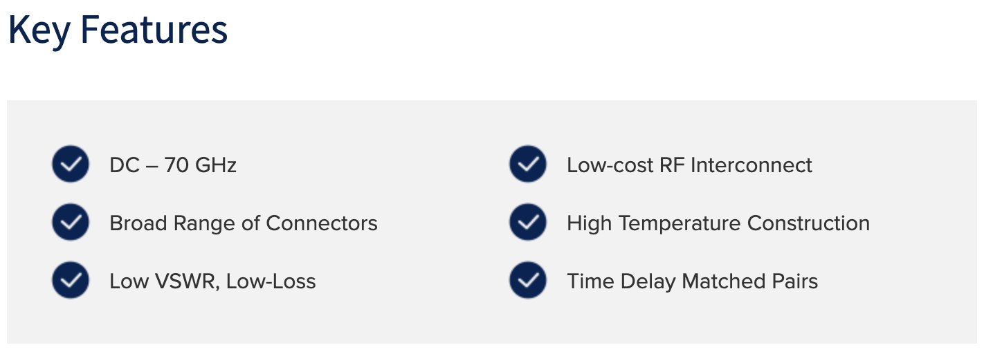 The image lists the key features of a product. On the left, features include "DC – 70 GHz," "Broad Range of Connectors," and "Low VSWR, Low-Loss." On the right, features include "Low-cost RF Interconnect," "High Temperature Construction," and "Time Delay Matched Pairs." Each feature is marked with a checkmark.