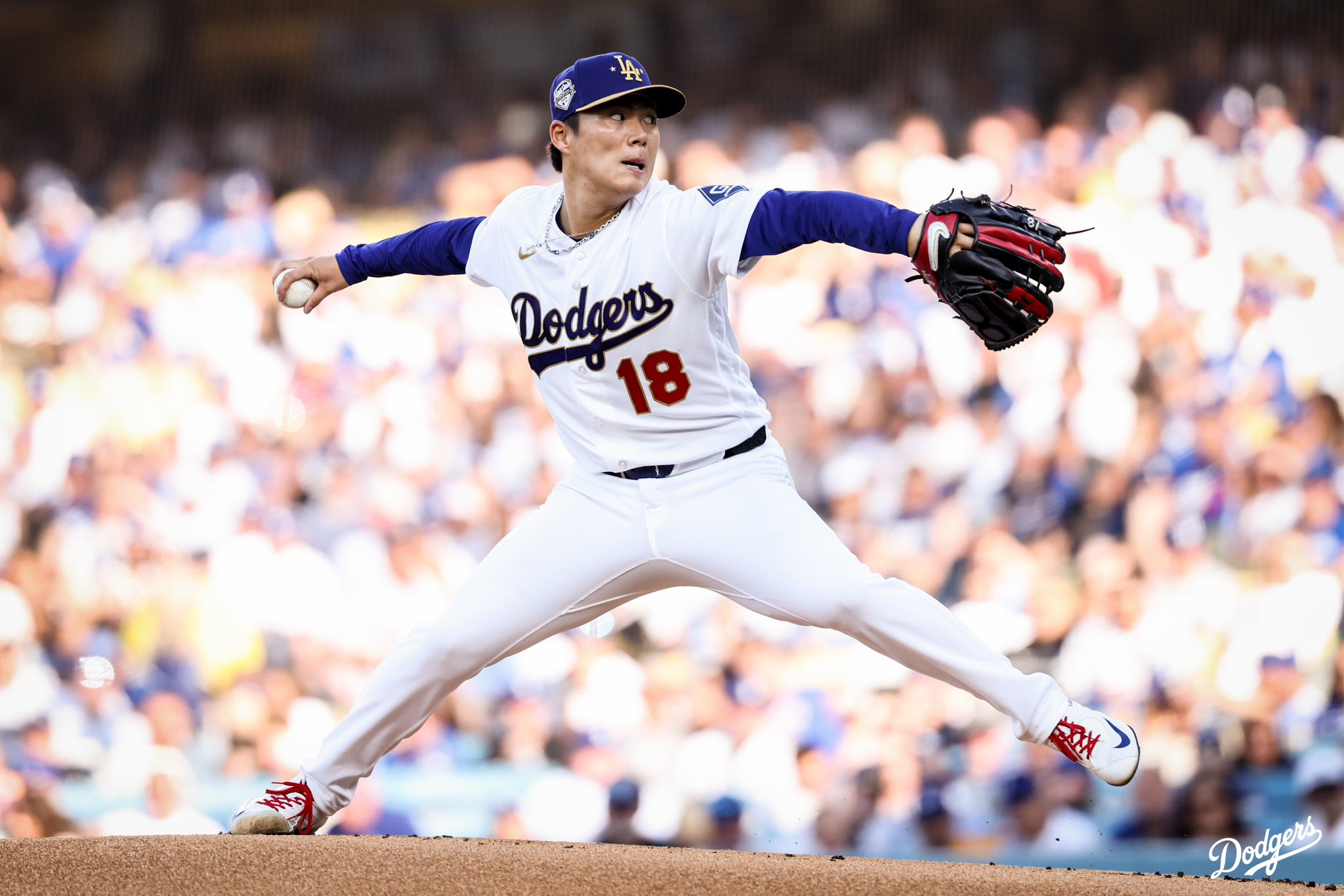 A photo of Yoshinobu Yamamoto throwing on the mound.
