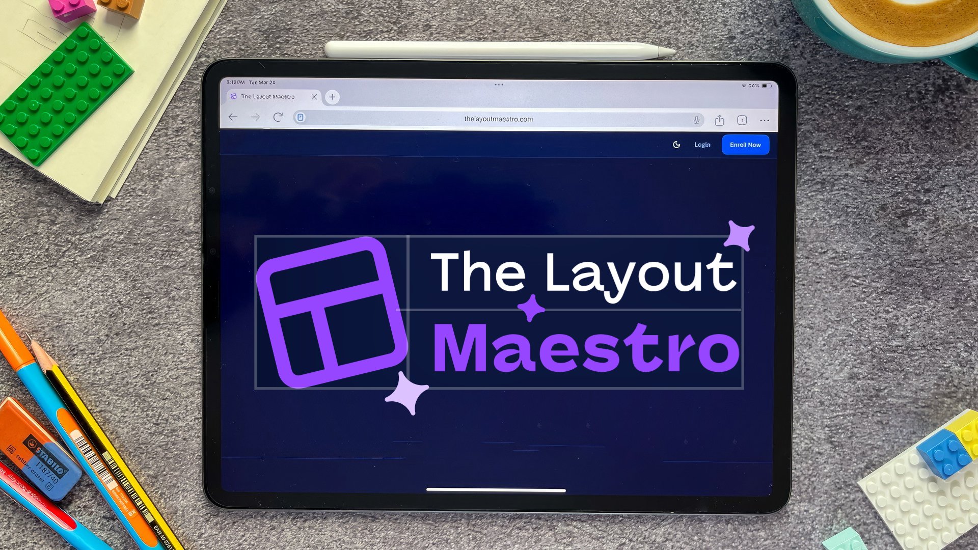 Photo of a tablet on a desk with LEGO bricks, pens, and a coffee cup. The screen shows "The Layout Maestro" with a purple grid logo.
