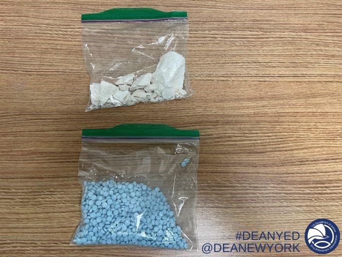 1,027 counterfeit oxycodone pills containing fentanyl and 97.6 grams of cocaine seized.
