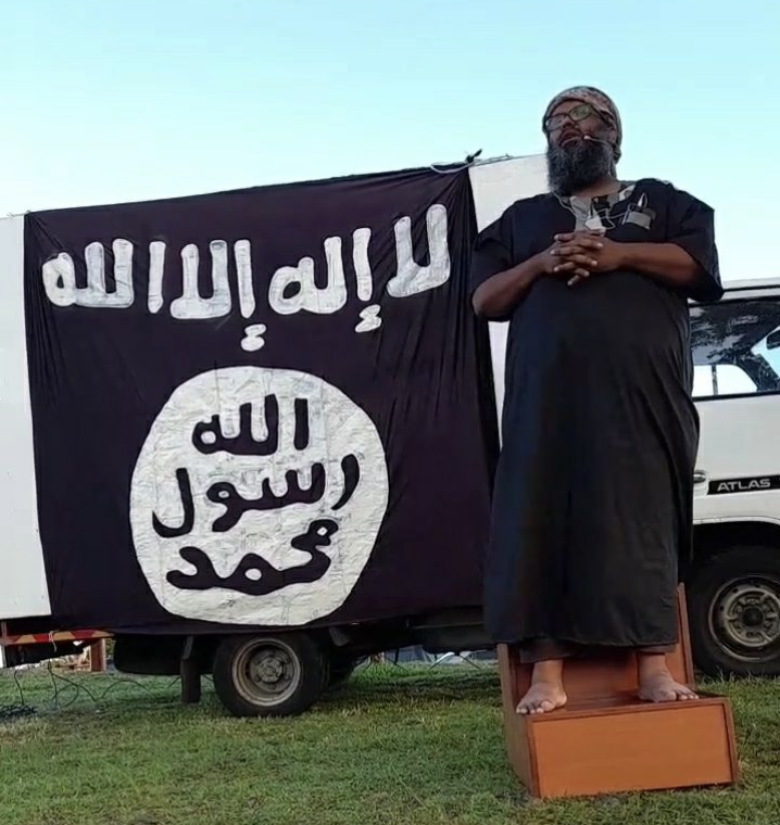 Javed Meetoo with IS banner  in Port Louis, Mauritius, 2025

