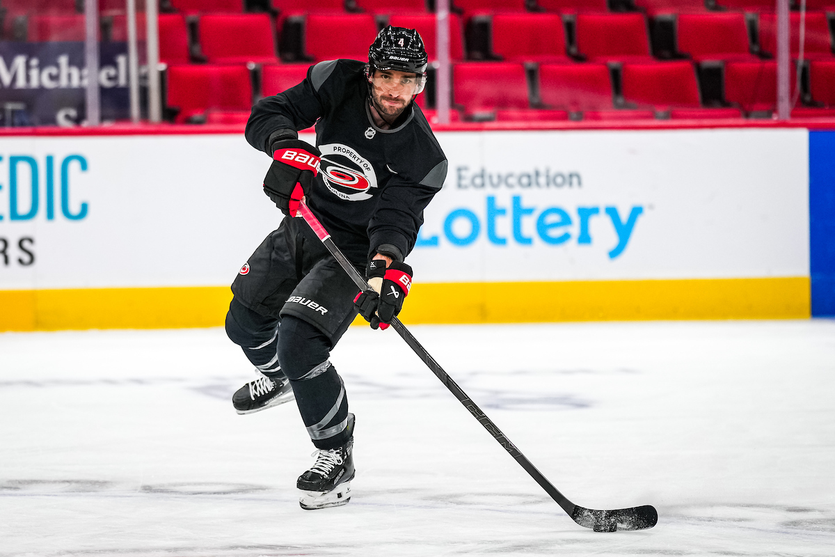 Shayne Gostisbehere moves a puck during a training camp practice.