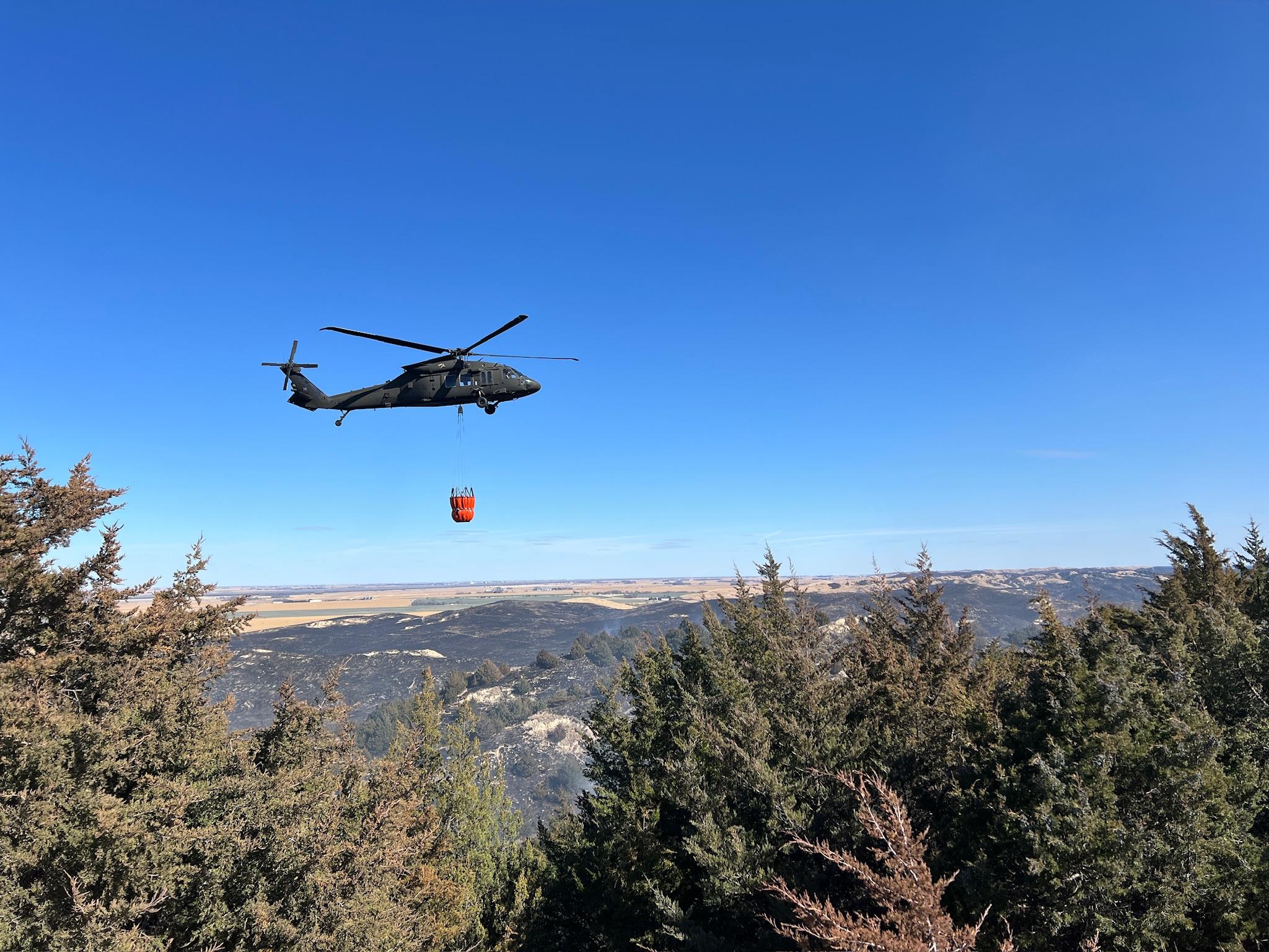 Cottonwood Fire, Nebraska. Photo from InciWeb. A National Guard helicopter supports wildfire suppression. 