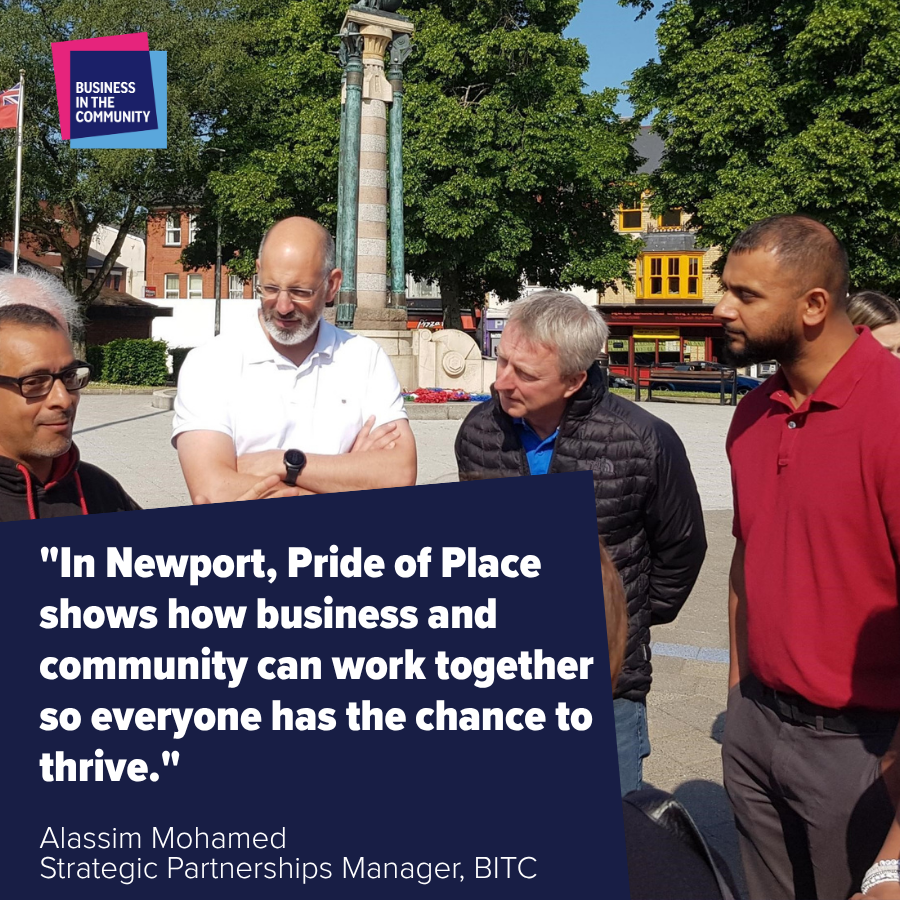 Four men stand outdoors discussing. Text reads: "In Newport, Pride of Place shows how business and community can work together to thrive."