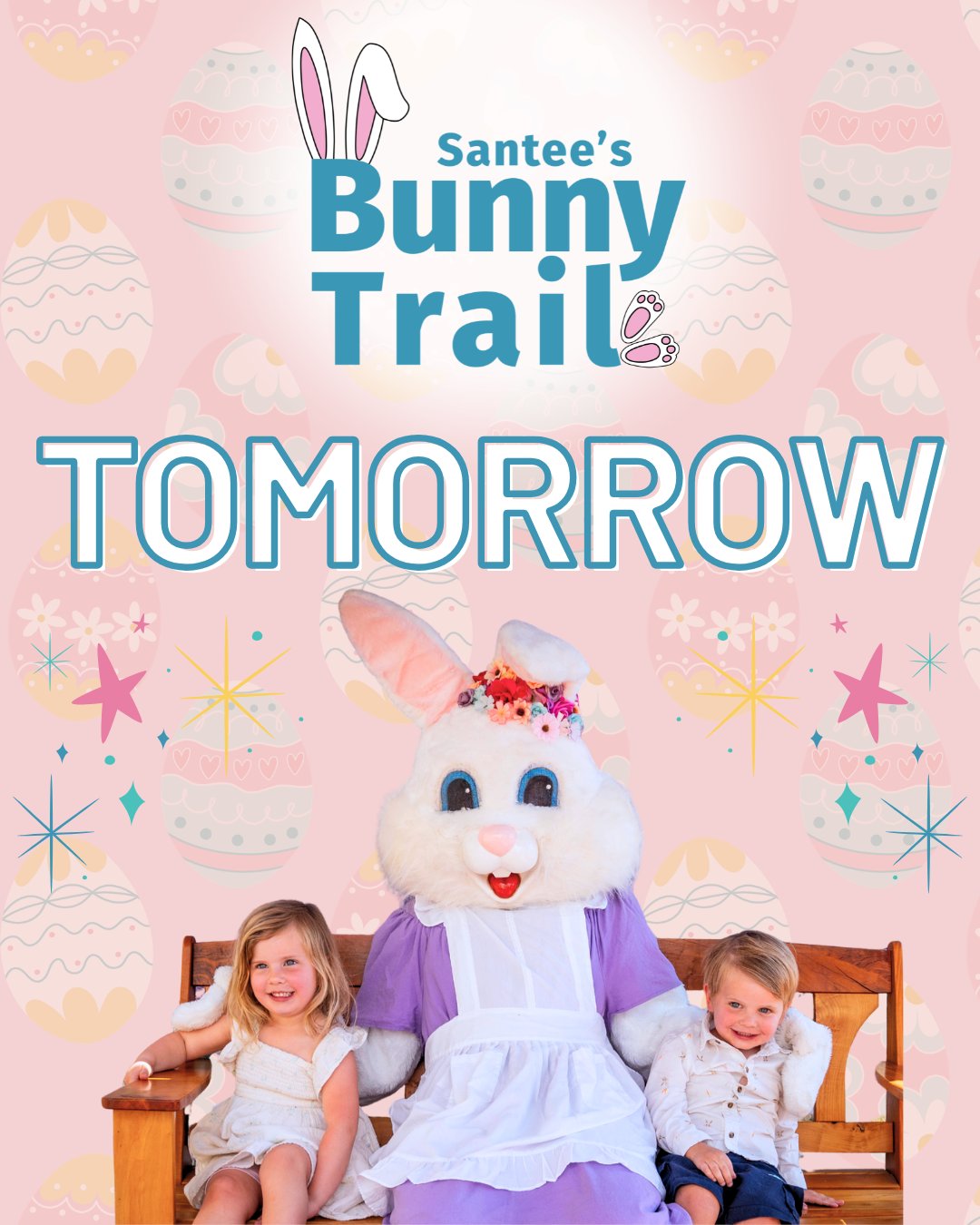 A person in a bunny costume sits on a bench between two young children, all smiling. The background features decorated Easter eggs and stars. Text reads, "Santee's Bunny Trail TOMORROW.