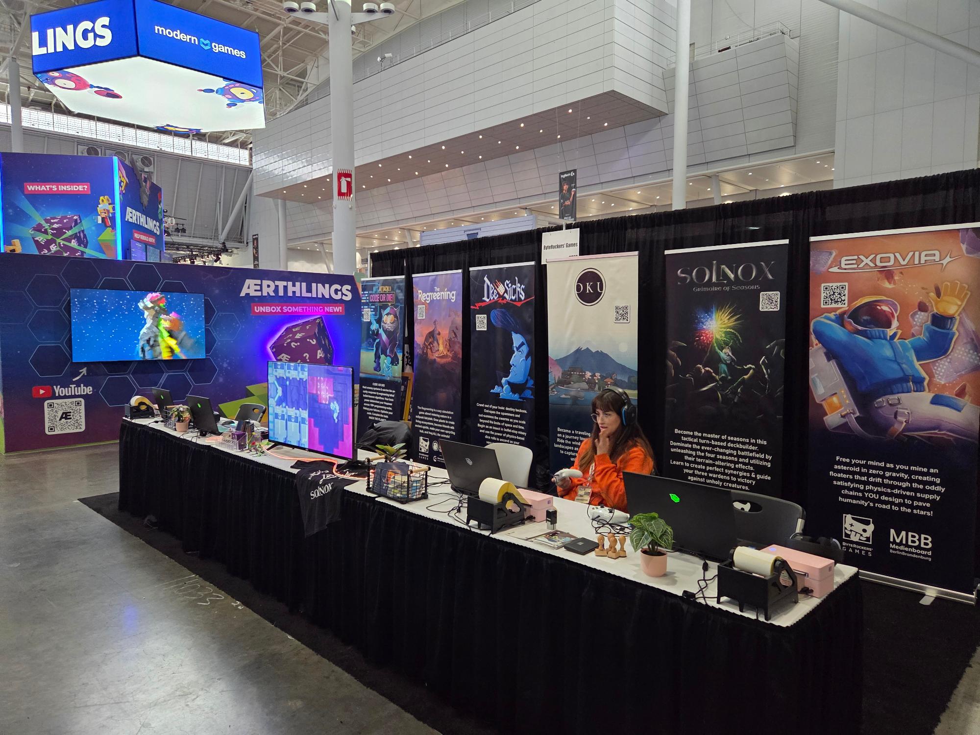 PAXEast booth before opening. Games: Net.Attack(), The Regreening, OKU, Solnox, Exovia