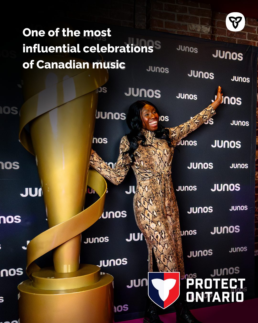 A person poses beside a large gold JUNO Award statue in front of a black backdrop patterned with repeated ‘JUNOS’ logos. Text on the image reads, ‘One of the most influential celebrations of Canadian music,’ and the Protect Ontario logo appears in the bottom right corner.