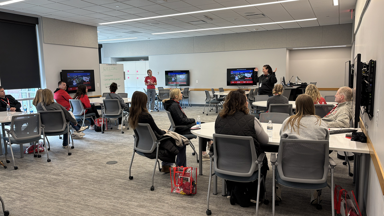 Dawn Lindsley speaks to a group of students and their families in a classroom in Carolyn Pope Edwards Hall