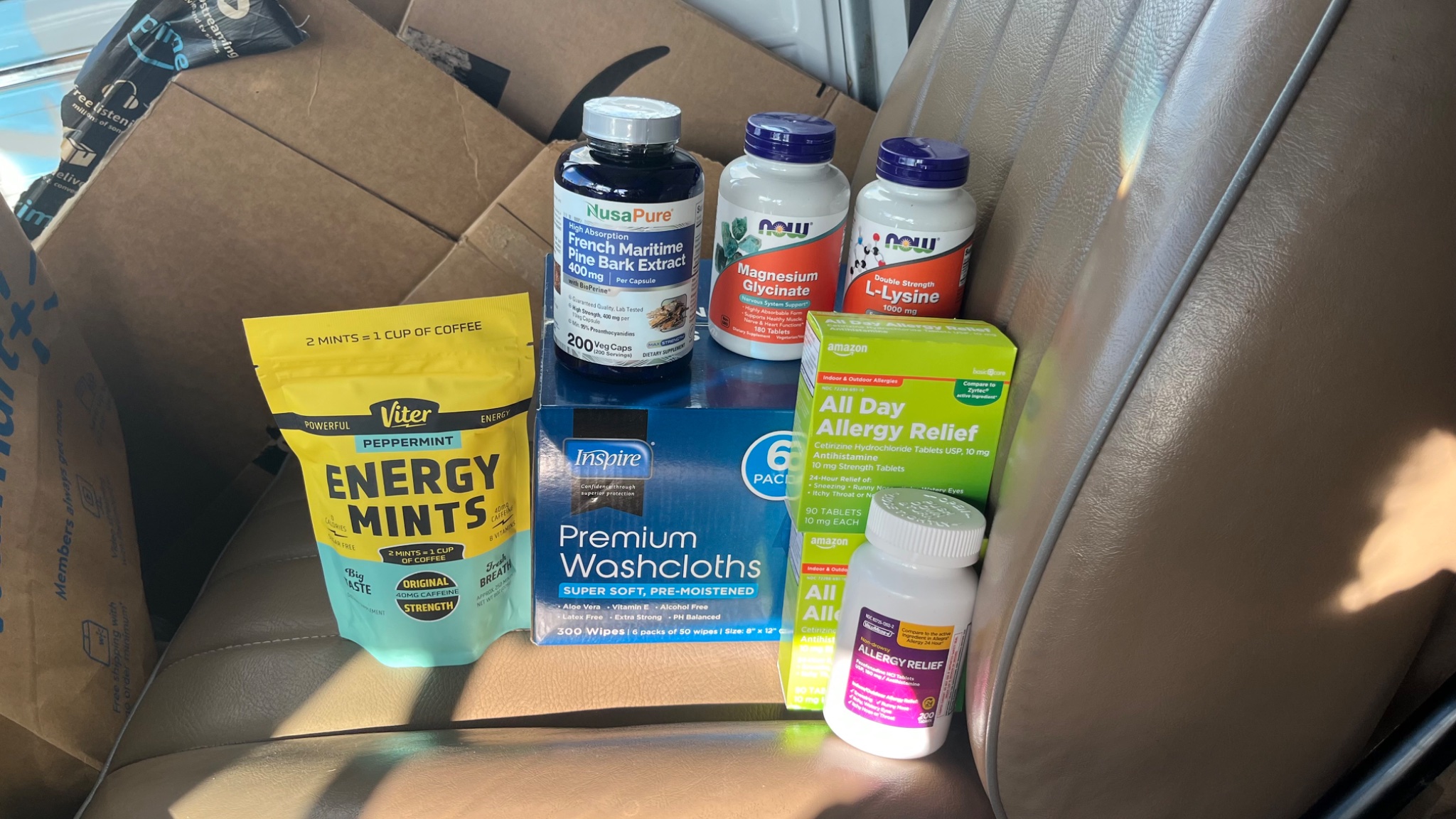 WL gits laid put on van's passenger seat: 
Cetrizine qty 2 boxes; bottle of fexofenadine; bottle of lysine; bottle of magnesium glycinate; bottle of pine bark extract; pkg of caffeine energy mints; case of cheap wipes